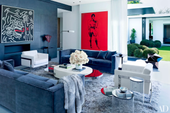 beautiful blue living room with wild red painting