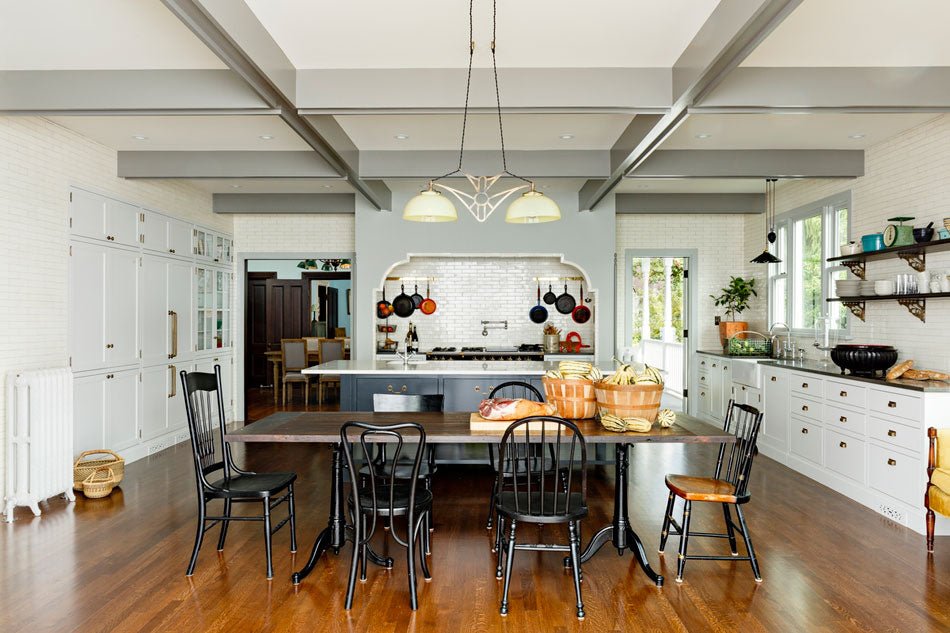 victorian kitchen with wood floor and farmhouse table