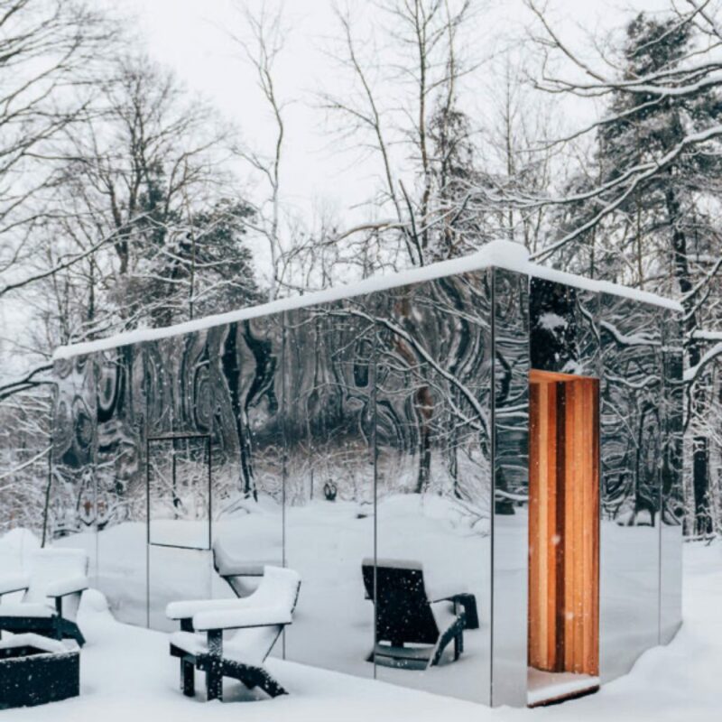 mirror glass outdoor sauna cabin in the snow